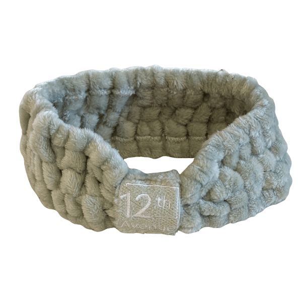 Textured headband with a brand label on a white background