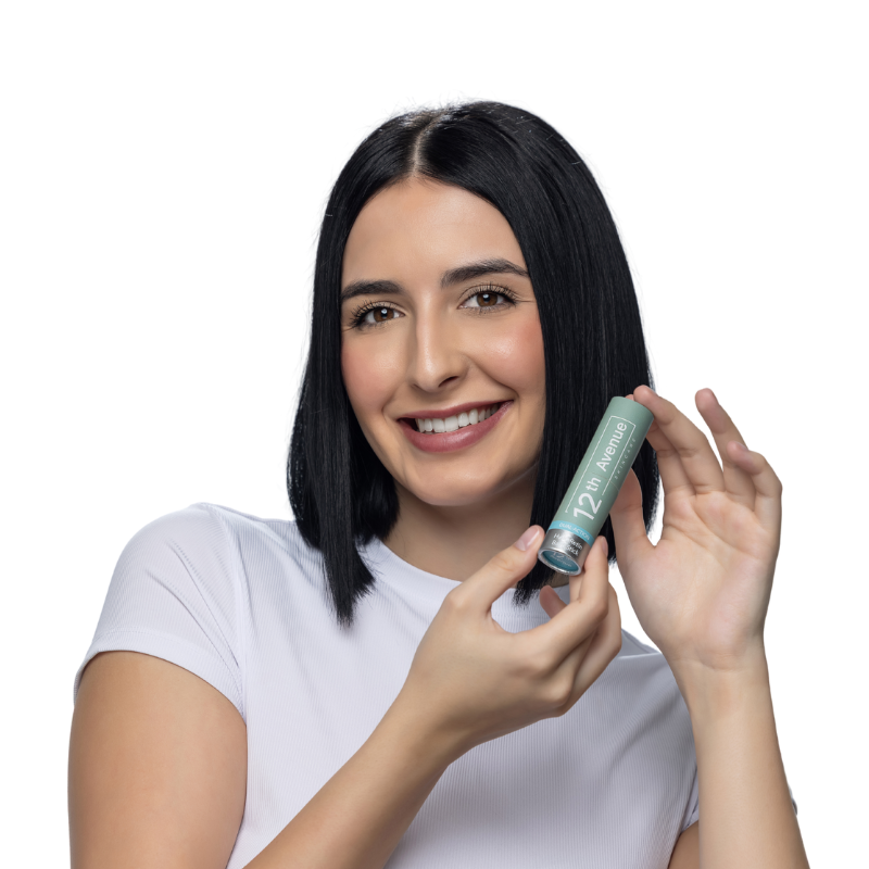 Woman holding a product with a white background